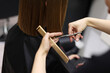 © Andriy Medvediuk - Unrecognisable hairdresser cutting female client hair with professional barber scissors and comb and making stylish haircut short bob hairstyle in beauty salon. Hair care, hair salon and hairstyling