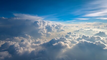 Aufkleber - Wonderful view from the airplane window flying above the clouds cumulus clouds with blue sky in sunny day and soft sunlight in the afternoon nature background, creative banner, copyspace image
