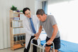 © Wanchai - A healthcare professional assists a senior patient with mobility exercises during a rehabilitation session, highlighting physical therapy, elderly care, and recovery support.