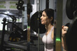 © FotoAndalucia - woman training exercises in gym alone, leg squats