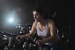 © FotoAndalucia - woman training in spinning room at gym