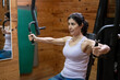 © FotoAndalucia - woman training exercises in gym with weights