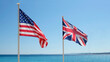 © lensw0rld - Stars and Stripes and Union Jack - US and UK national flags against the blue sky