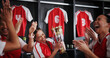 © peopleimages.com - Happy women, soccer team and celebration with trophy for winning, victory or tournament in locker room. Excited, female people or sports players with smile for competition, success or award together