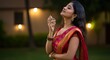 © phj.domingos - Serene Indian Woman in Saree Applying Perfume Outdoors Embracing Tranquility and Celebrating Culture with an Evening Glow Serene Moment of Reflection