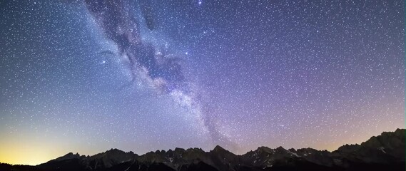 Wall Mural - Anamorphic video Amazing Natural Landscape View with Marvelous Bright Milky Way Stars Shining on Mountains 