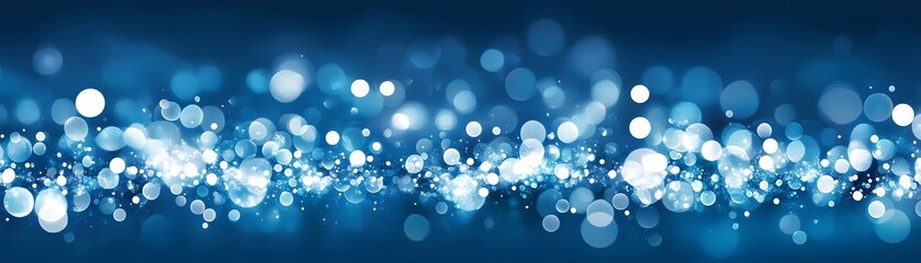 Abstract design of blue and white bokeh lights.