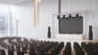 © Jayeda akter - Modern auditorium interior with stage lighting screen and rowed seating for presentations