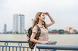 © Pavitra - Asian young beautiful woman backpacker exploring the city outdoors.
