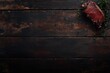 © Sarinya - Juicy ribeye steak on dark wooden table top view rustic style food photography with thyme garnish and empty space for text
