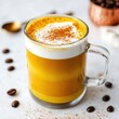 © Julia Jones - Creamy turmeric latte with cinnamon topping and coffee beans