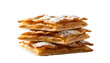 © sojibahmad - A stack of four puff pastry squares sprinkled with powdered sugar