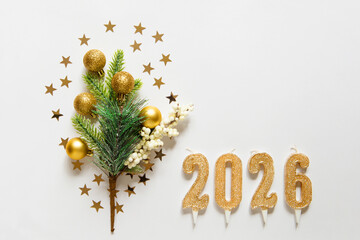 Wall Mural - christmas frame with christmas tree branch, gold balls, candles 2026 and stars on white background