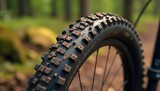 Close-up of rugged mountain bike tires, showing tread detail and mud , tire pressure, bike shop, off-road