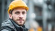 © 路加 石 - A determined construction worker in safety helmet, embodying resilience and focus in industrial labor.