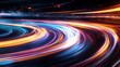 © Watcharaporn - Vibrant long exposure light trails on a dark night creating dynamic abstract motion illusion in vivid colors and flowing lines