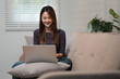 © mojo_cp - Happy excite asian woman winner watching laptop at home