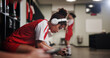 © peopleimages.com - Girl, soccer player and headphones in locker room for music, sports and inspiration for game. Profile, woman and athlete with streaming, listen and prepare with audio subscription for football match