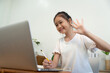 © Natee Meepian - Back to School online study session with girl engaging via laptop