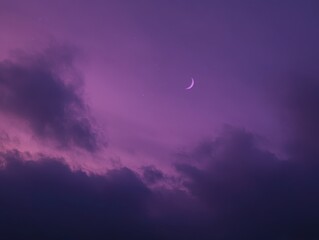 Wall Mural - Crescent moon shining brightly in the night sky with dark clouds and stars above in a dreamy purple tone