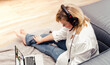 © Olena Poberezhna - Woman  blogger holds video conference from home. Modern lifestyle of a female businesswoman.