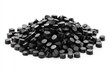 © At My Hat - A pile of black polymer granules on a white background, close up shot. It is useful for plastic, or chemical industry business purpose.