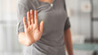 © sebra - Woman making stop sign at home