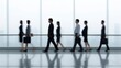 © Dzikrul Husnani - Group of People Walking in a Hallway Business Professionals