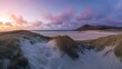 © Tanvir - Panorama landscape of sand dunes system on beach at sunrise .