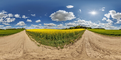 Wall Mural - hdri 360 panorama on gravel road near rapeseed fields in equirectangular full seamless spherical pro