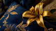 © alexandra_pp - Golden lily in bloom resting on ornate royal blue and gold embroidered fabrics