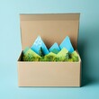 © Shehroo Time - Minimal Cardboard Box with Pastel Grass and Mountain Horizon