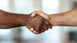 © Dimas - Close Up of Two Men Shaking Hands Showing Unity and Agreement