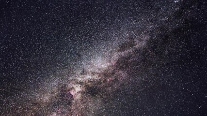 Wall Mural - beautiful night sky time lapse with milky way galaxy on dark sky. starry night background.
