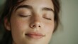 © Yopi - Close-Up Portrait of a Young Woman with Freckles and Eyes Closed