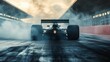 © Gabriel - Dramatic shot of a formula 1 race car leaving a cloud of smoke on the racetrack.