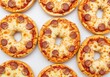 © Sejjil - Bagel pizzas with pepperoni isolate on white background