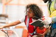 © chokniti - Empowered female engineer demonstrates strength and expertise in industrial operations, leading production processes, handling machinery, inspiring innovation, fostering teamwork, enhancing technical