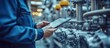 © adiba - Industrial worker using tablet in factory