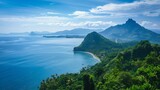 Coastal Landscape View of Mountains Sea and Green Vegetation Under a Clear Blue Sky