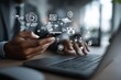 © Ketsaratchaya - Business professional using smartphone and laptop with digital communication icons in a modern workspace environment
