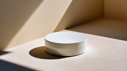 Aufkleber - White ceramic canister sits on a smooth beige surface, illuminated by gentle light creating soft shadows, ideal for showcasing product design and styling