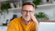 © Dzikrul Husnani - Smiling Man Wearing Glasses Looking at Camera in a Bright Room