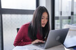 © Charlie's - Beautiful confident asian business woman working with laptop Hands typing keyboard. Professional investor working new start up project. business planning in office. Technology business.