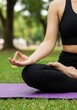© Siasart Stock - Photo of Woman Meditating in Lotus Position in Park