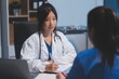 © Phanphen - Doctor working in the office and listening to the patient, she is explaining her symptoms, healtcare and assistance concept