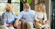 © peopleimages.com - Family, grandparents and child with smile, home and talking to granddaughter in living room or chat. Happy, elderly man and old woman with girl in lounge, together and senior people with kid in house