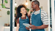 © peopleimages.com - Cafe, entrance and team with tablet, smile and welcome with small business people. Partnership, confidence and happy restaurant staff at door on digital app for online booking, orders or review
