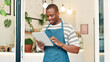 © peopleimages.com - Barista, tablet and reading with black man in cafe for research, digital inventory or restaurant supply checklist. Waiter, catering review and small business owner with person in coffee shop for menu