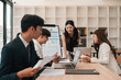 © saltdium - Smiling Businesswoman Leading Productive Team Discussion, Creative Office Collaboration